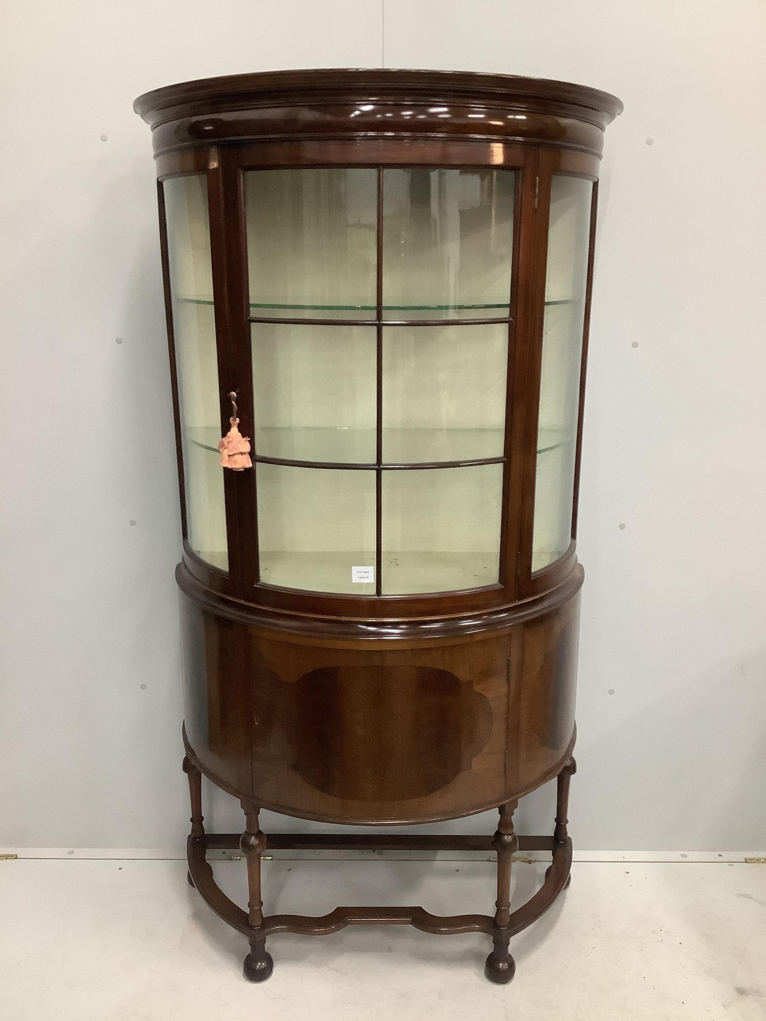 An Edwardian mahogany bow fronted glazed china display cabinet, with cupboard under, width 97cm, depth 44cm, height 181cm